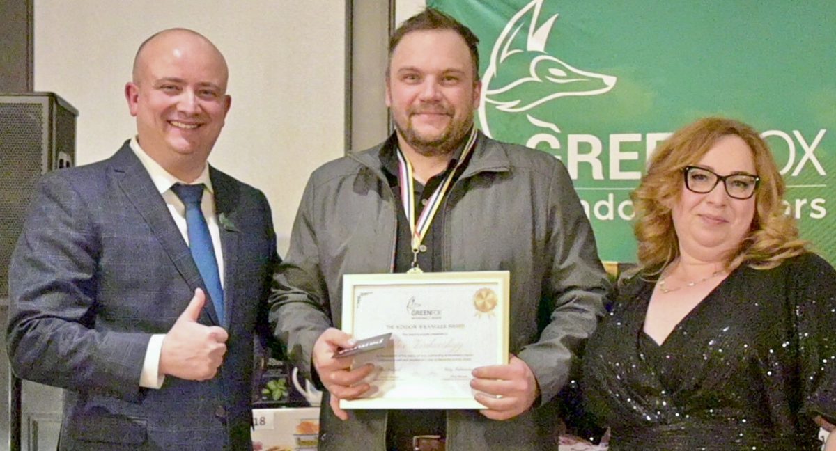 Adam receiving the GreenFox Window Wrangler Award 2023