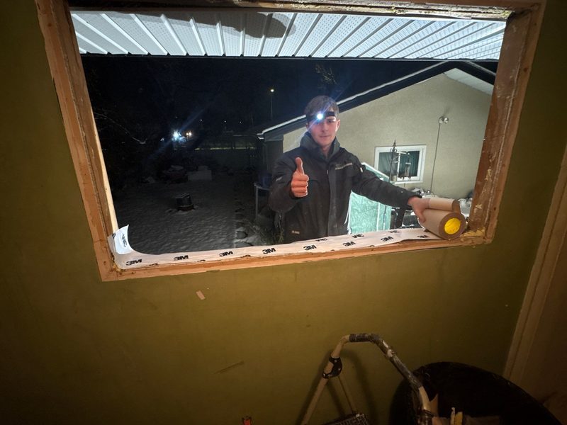 Team installing window, finished exterior view