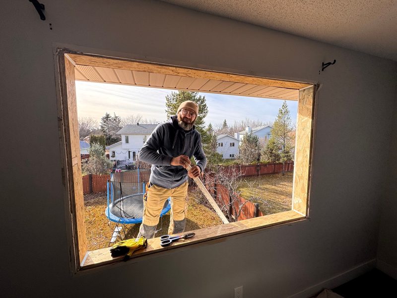Team members installing window